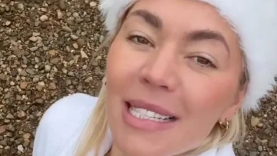 A Place in the Sun's Danni Menzies sports skimpy red bikini for icy dip in lake