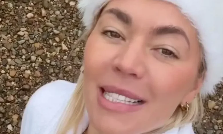 A Place in the Sun's Danni Menzies sports skimpy red bikini for icy dip in lake