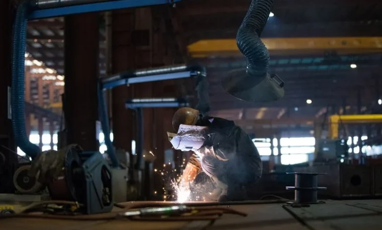 China's factory activity snaps record slump on festive stockpiling