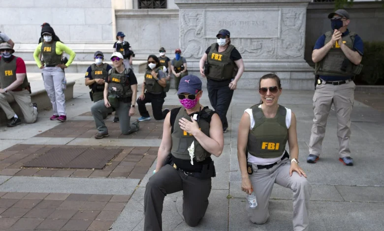 FBI agents sue after being fired for kneeling during racial justice protest : NPR