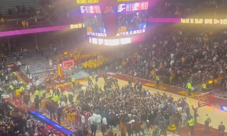 Gophers fans storm the court after upset win over No. 22 Indiana