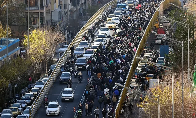 Iranian protesters clash with security forces as tear gas fills Tehran streets amid nationwide unrest