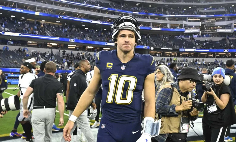 Justin Herbert not practicing today after left hand surgery