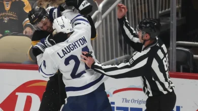 Leafs' Scott Laughton goes after Pens' Evgeni Malkin for attempting to clip him in the head