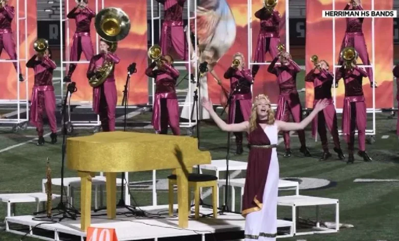 Musician surprises Herriman High School marching band while on tour