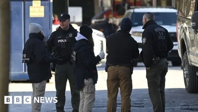 Police identify person of interest in Brown University shooting, sources say