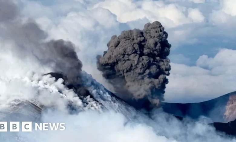 Snow-capped Mount Etna erupts as skiers glide down slopes