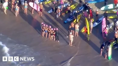 Surfers and swimmers pay tribute to victims of Bondi shooting