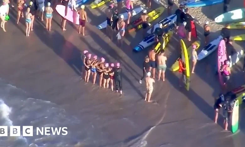 Surfers and swimmers pay tribute to victims of Bondi shooting