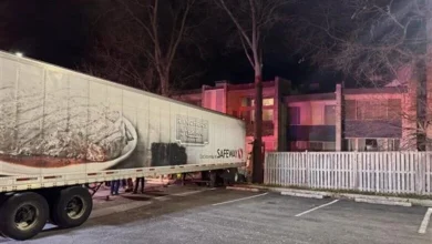 Tractor-trailer rolls through fence, nearly strikes 3-story apartment building in Rockville