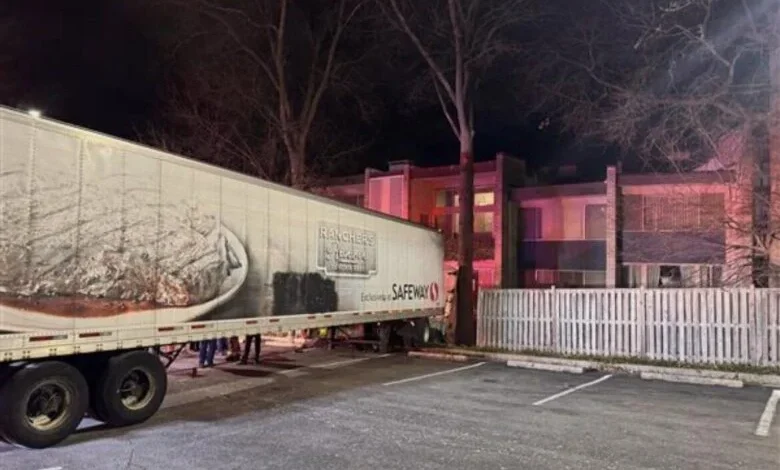 Tractor-trailer rolls through fence, nearly strikes 3-story apartment building in Rockville