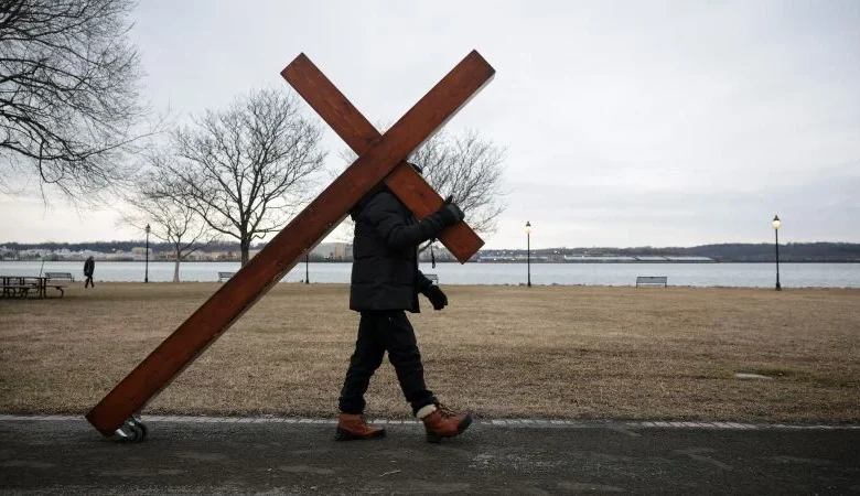 When communities are grieving, Dan Beazley arrives bearing a 10-foot cross. Here’s his story
