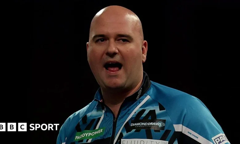 World Darts Championship: Rob Cross and Ryan Searle coast into second round on day two