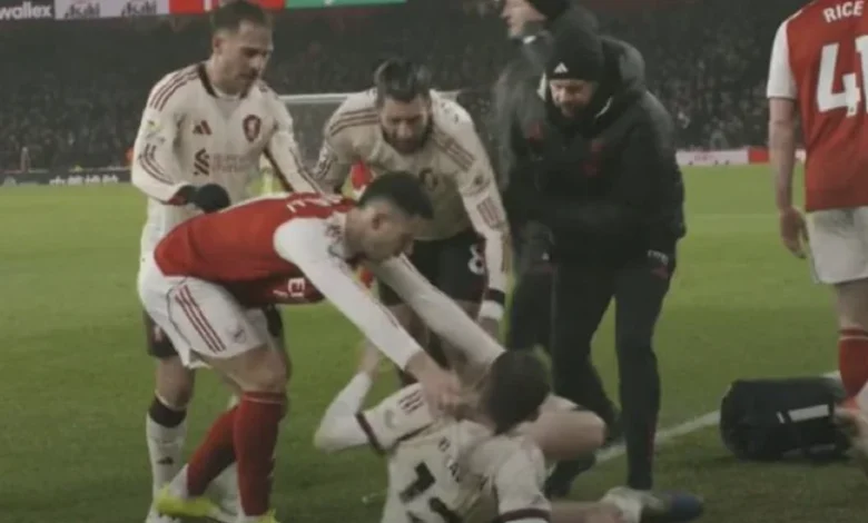 Arsenal star sparks melee by shoving Liverpool ace before he's carried off injured