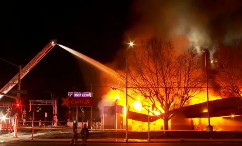 Crews battling large fire at former Carl's Jr. location near Fresno City College