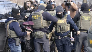 Crowd confronts immigration agents door-knocking in south Minneapolis