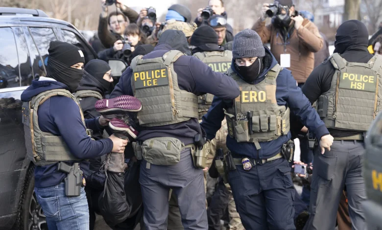 Crowd confronts immigration agents door-knocking in south Minneapolis