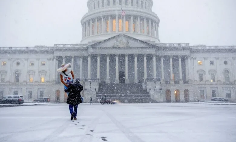 DC area braces for winter storm that could blanket the region with 10 inches of snow, plus freezing rain