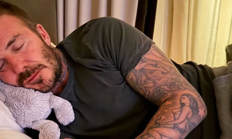David Beckham uses cuddly toy as pillow after dancing himself into a slumber with wife Victoria and daughter Harper