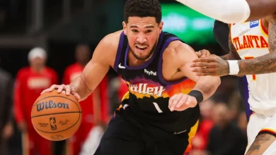 Devin Booker injures right ankle, exits game after teammate goes down
