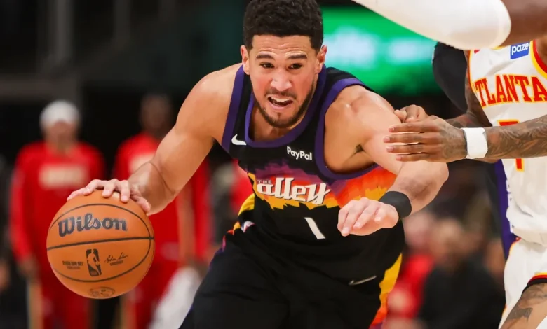Devin Booker injures right ankle, exits game after teammate goes down
