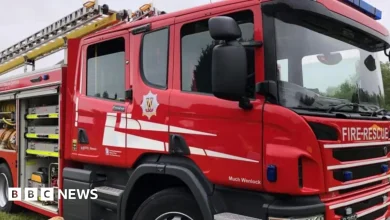 Dozens of firefighters tackle large house fire