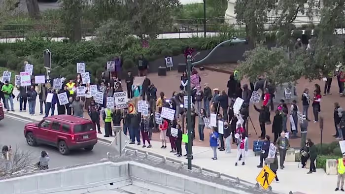 Dozens protest in San Antonio against immigration enforcement on Trump’s one-year mark in office
