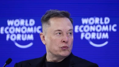 Elon Musk, a fierce Davos critic, tells World Economic Forum that robots will outnumber humans