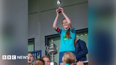 Girls football team win tiny plastic cup as boys take home full-size trophy