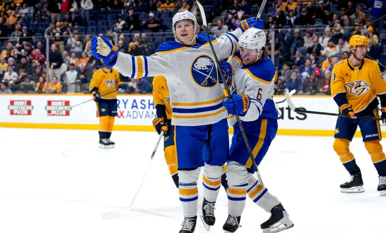 Helenius gets 1st 3 NHL points, Sabres hold off Predators