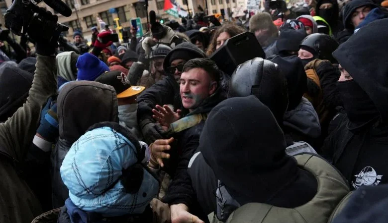 Jake Lang chased away by counterdemonstrators while leading small rally in Minneapolis