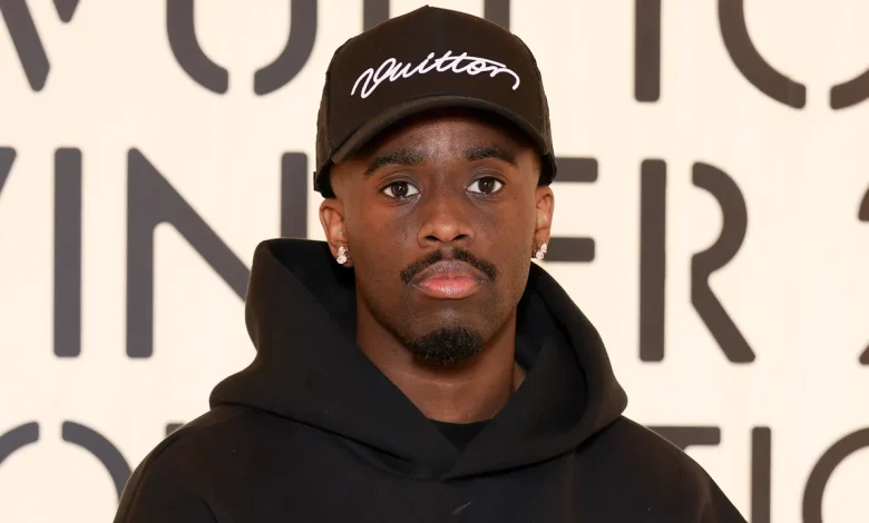 Kai Cenat Went Analog With This Unexpected Fashion Week Accessory — See Photos