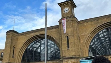 London King's Cross LIVE: Protester scales station building as firefighters swarm scene