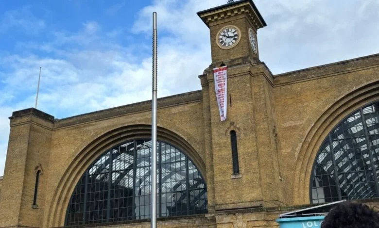 London King's Cross LIVE: Protester scales station building as firefighters swarm scene