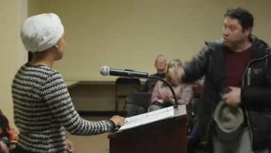 Man charges at Rep. Ilhan Omar and sprays her with substance at town hall