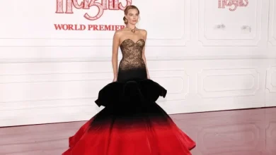 Margot Robbie Poses in Crimson Gown Ahead of Wuthering Heights Release