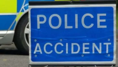 Motorway closed after car and motorbike crash