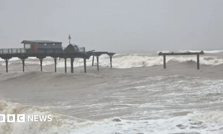 Pier washes away and railway sea wall crumbles in storm