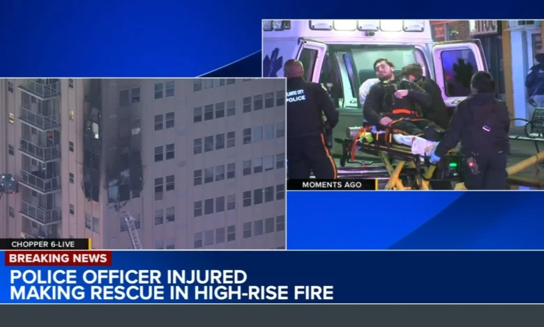 Police officer injured while making rescue during residential high-rise building fire in Atlantic City, New Jersey