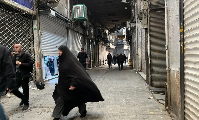 Security forces clash with protesters in Iran's main market : NPR