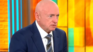 Sen. Mark Kelly says Hegseth's move to demote him "is about stifling people's speech"