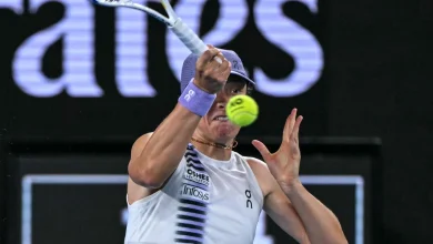 Swiatek survives roller coaster to reach Australian Open last 16