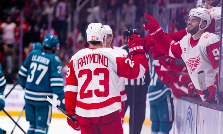 Todd McLellan counts Detroit Red Wings while his wife shovels snow