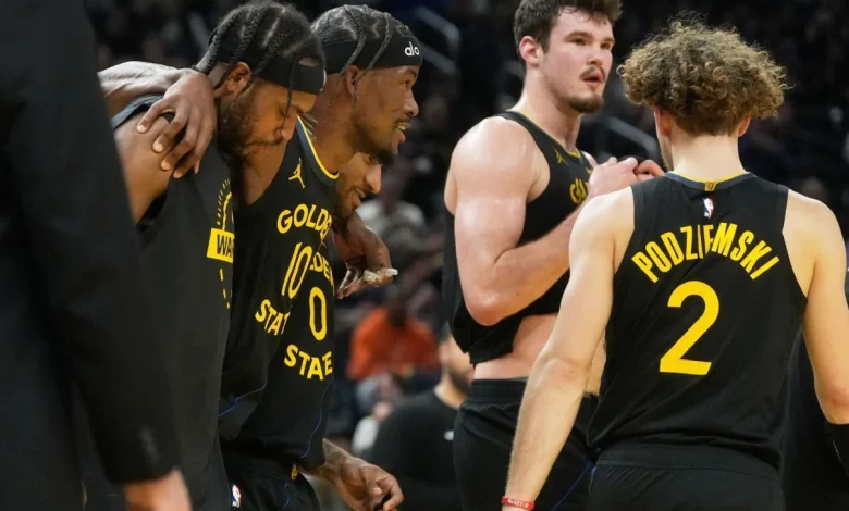 Warriors' Jimmy Butler helped off with knee injury vs. Heat