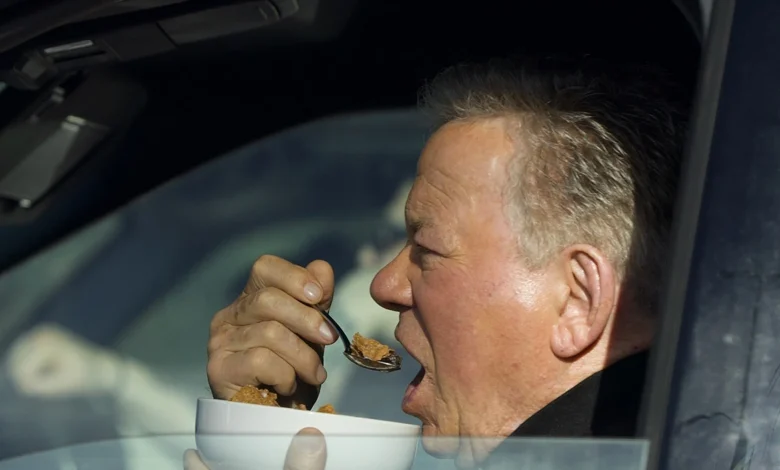 William Shatner Photographed Eating Bowl of Cereal in His Car at Stop Light