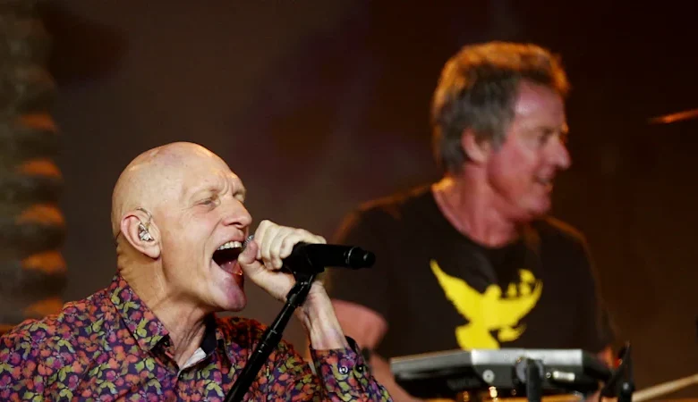 ‘We are shattered’: Peter Garrett joins tributes as Midnight Oil’s Rob Hirst dies aged 70