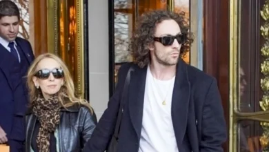 Aaron Taylor-Johnson & Wife Sam Hold Hands as They Check Out of Paris Hotel