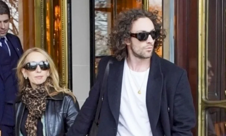 Aaron Taylor-Johnson & Wife Sam Hold Hands as They Check Out of Paris Hotel