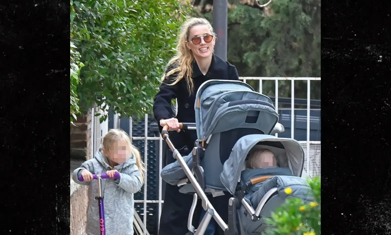 Amber Heard All Smiles as Johnny Depp Films Hollywood Return