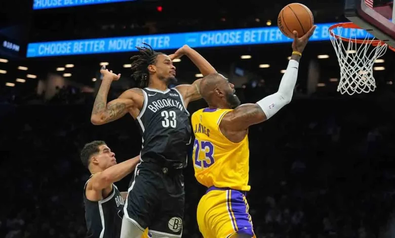 Doncic, James help Lakers rout Nets in Reaves' return from injury